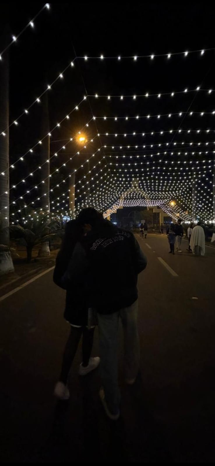 Walking under a thousand fairy lights with you.